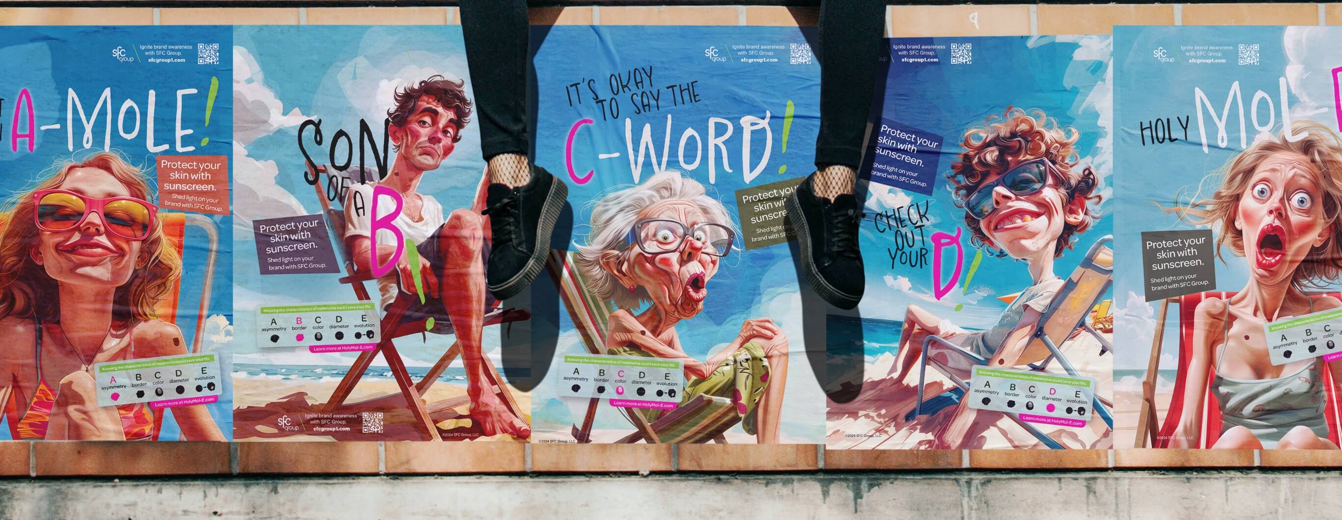 A person sitting on the wall with posters demonstrating the ugliness of melanoma. We can see only the legs of this person, wearing black pants and black sneakers